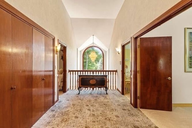 hallway with light colored carpet