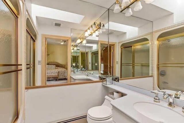 bathroom with ensuite bathroom, vanity, visible vents, toilet, and a skylight