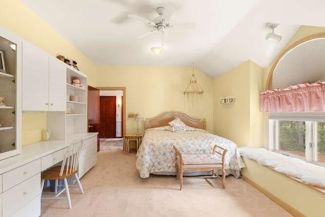 bedroom featuring light colored carpet, ceiling fan, and vaulted ceiling