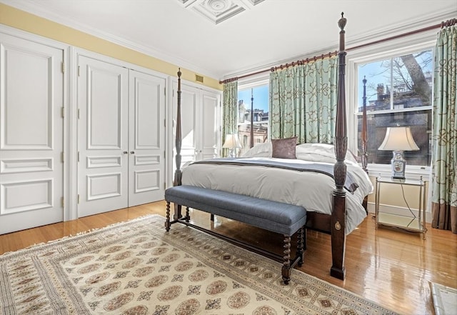 357-359 Beacon St Unit 4, Boston, MA 02116 - bedroom with ornamental molding, light wood-type flooring, multiple closets, and visible vents