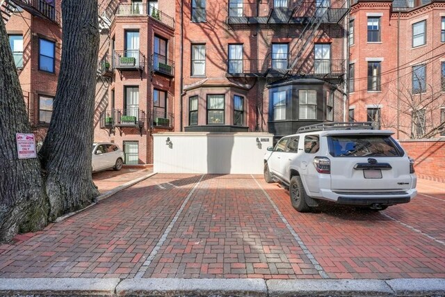 357-359 Beacon St Unit 4, Boston, MA 02116 - view of front of home featuring uncovered parking and brick siding