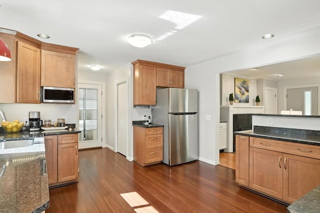 9 E Colonial Rd, Wilbraham, MA 01095 - kitchen featuring stainless steel appliances, dark wood-style flooring, dark stone countertops, recessed lighting, and brown cabinetry