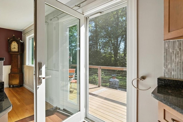 9 E Colonial Rd, Wilbraham, MA 01095 - doorway to outside featuring wood finished floors and a wainscoted wall