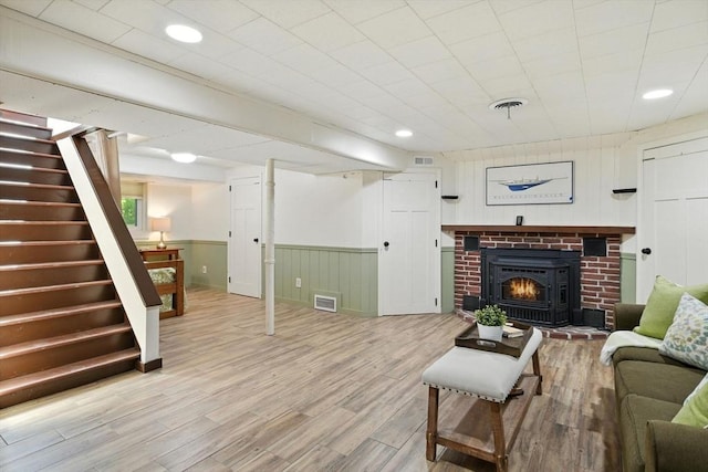 9 E Colonial Rd, Wilbraham, MA 01095 - living area featuring stairway, light wood-style floors, wainscoting, a fireplace, and recessed lighting