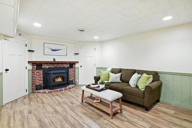 9 E Colonial Rd, Wilbraham, MA 01095 - living room featuring wood finished floors, recessed lighting, a brick fireplace, and wainscoting