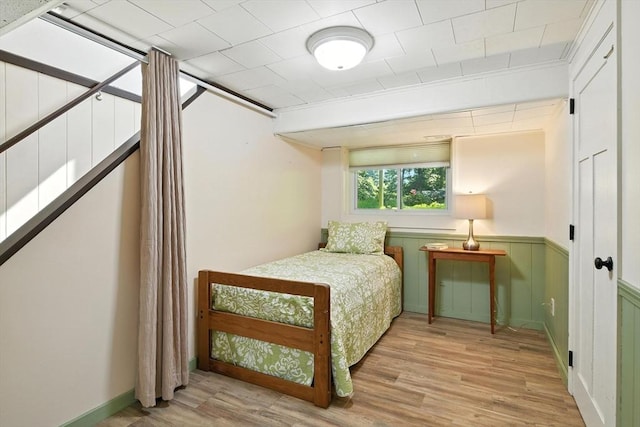9 E Colonial Rd, Wilbraham, MA 01095 - bedroom featuring light wood-type flooring and a wainscoted wall