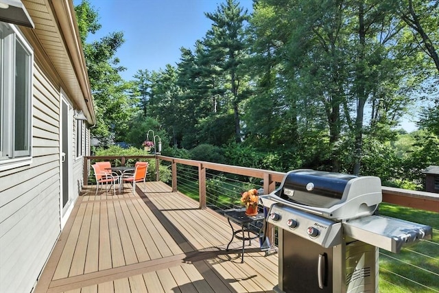 9 E Colonial Rd, Wilbraham, MA 01095 - wooden terrace with a grill, outdoor dining area, and view of scattered trees