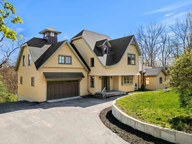 743 Main St, West Newbury, MA 01985 - view of front of house with asphalt driveway, a front yard, a garage, and roof with shingles
