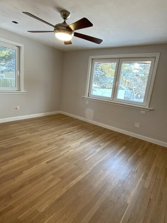 unfurnished room with light hardwood / wood-style floors and ceiling fan