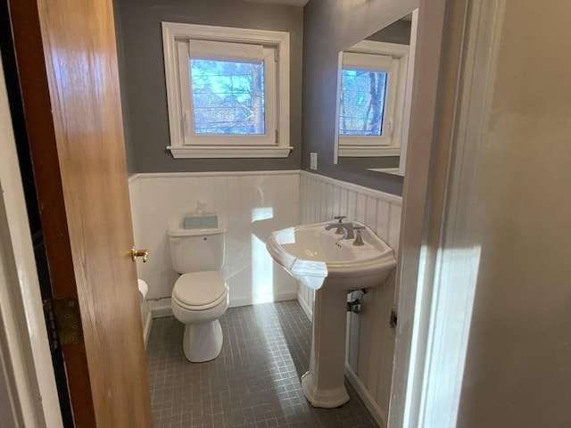 bathroom with tile patterned flooring and toilet