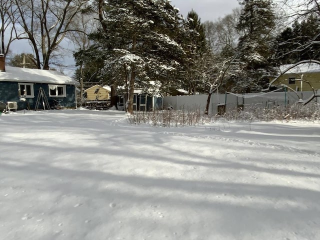 view of yard layered in snow