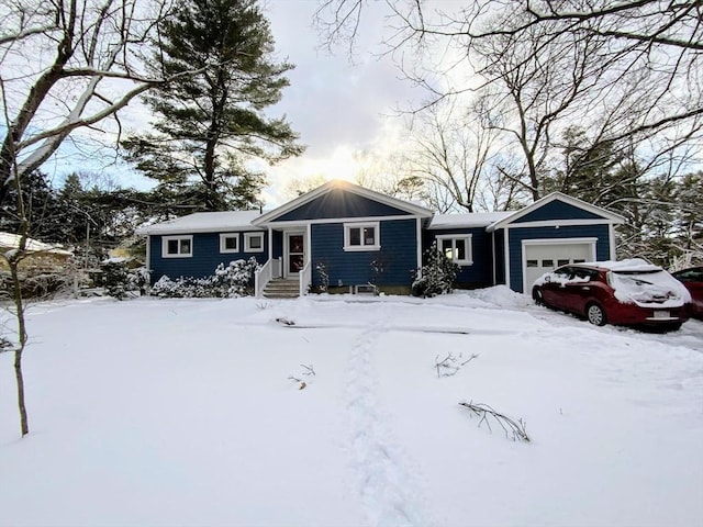 ranch-style house featuring a garage