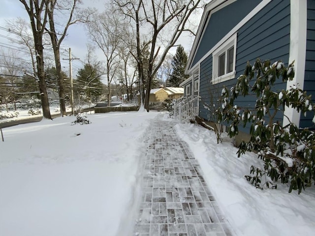 view of yard layered in snow