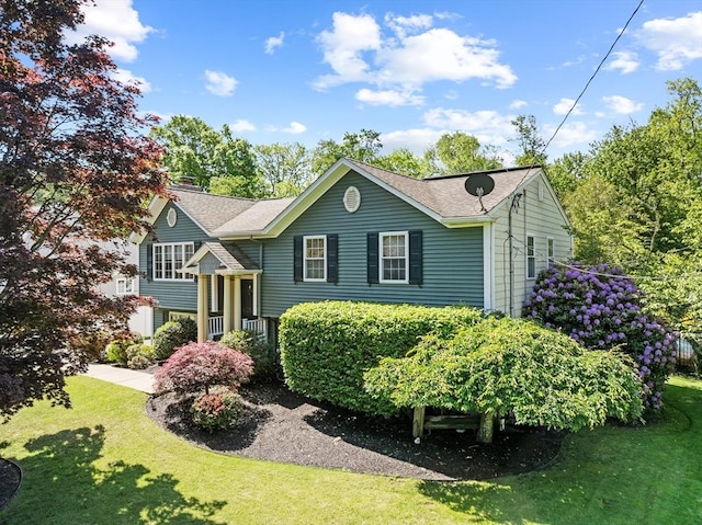 77 Columbus Dr, Fall River, MA 02720 - raised ranch with a front yard and roof with shingles