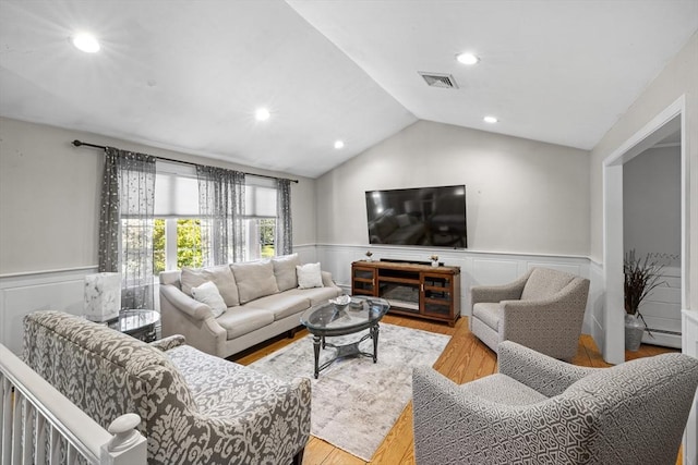 77 Columbus Dr, Fall River, MA 02720 - living area featuring wainscoting, wood finished floors, lofted ceiling, a baseboard heating unit, and recessed lighting