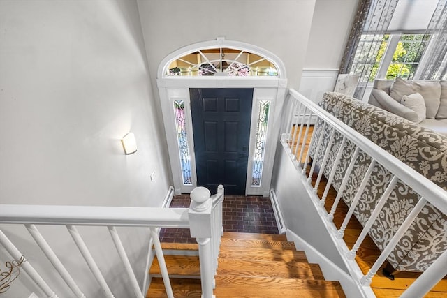 77 Columbus Dr, Fall River, MA 02720 - foyer featuring brick patterned floors, stairs, and baseboards