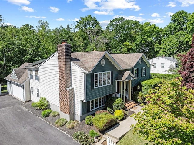 77 Columbus Dr, Fall River, MA 02720 - view of front facade featuring a chimney and roof with shingles
