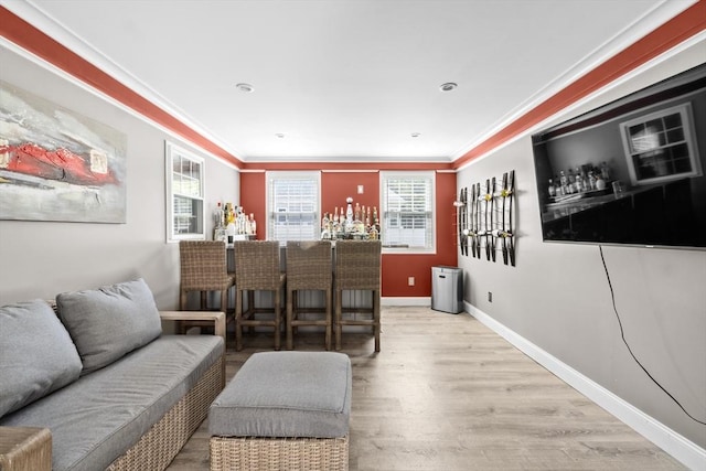77 Columbus Dr, Fall River, MA 02720 - living room with a dry bar, healthy amount of natural light, crown molding, wood finished floors, and baseboards