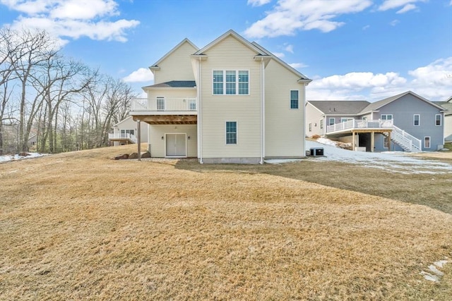 rear view of house featuring a deck