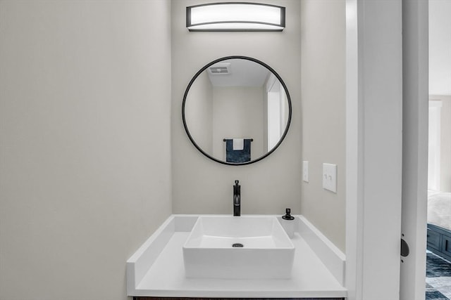 bathroom featuring visible vents and vanity