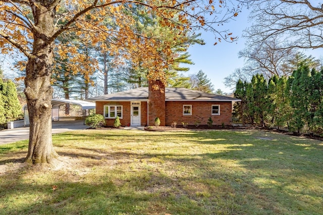 ranch-style house with a front yard and a carport