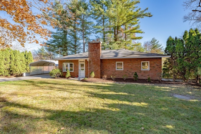 exterior space featuring a carport and a lawn