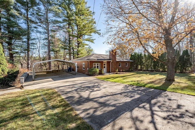 ranch-style home with a front yard and a carport