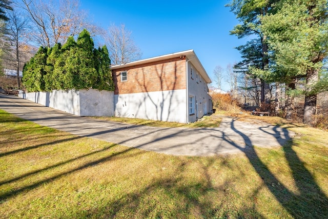 view of property exterior featuring a yard