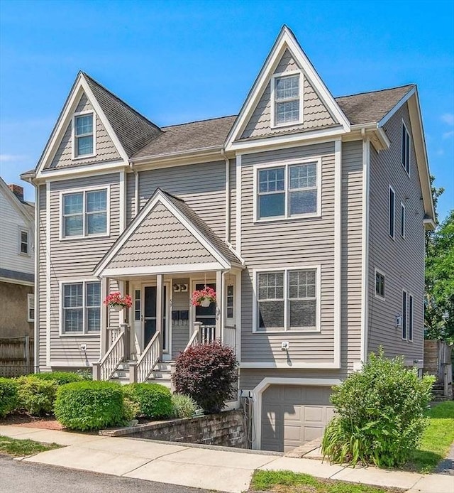 57 Alma Ave Unit 57, Belmont, MA 02478 - view of front facade with a garage and covered porch