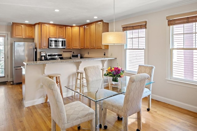57 Alma Ave Unit 57, Belmont, MA 02478 - dining area with crown molding, plenty of natural light, light wood-style flooring, and recessed lighting