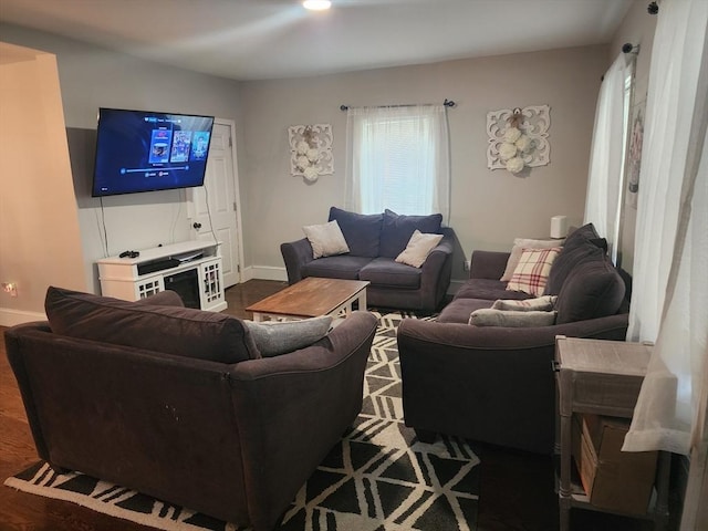 6 Pond St, Avon, MA 02322 - living area featuring dark wood-style flooring and baseboards