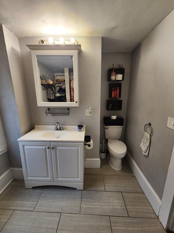 6 Pond St, Avon, MA 02322 - bathroom featuring toilet, vanity, and baseboards