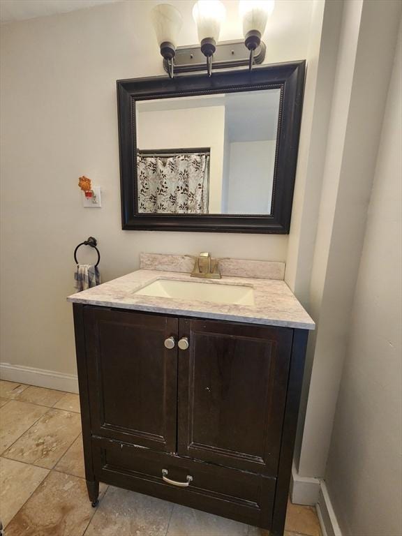 6 Pond St, Avon, MA 02322 - full bath with tile patterned flooring, vanity, and baseboards