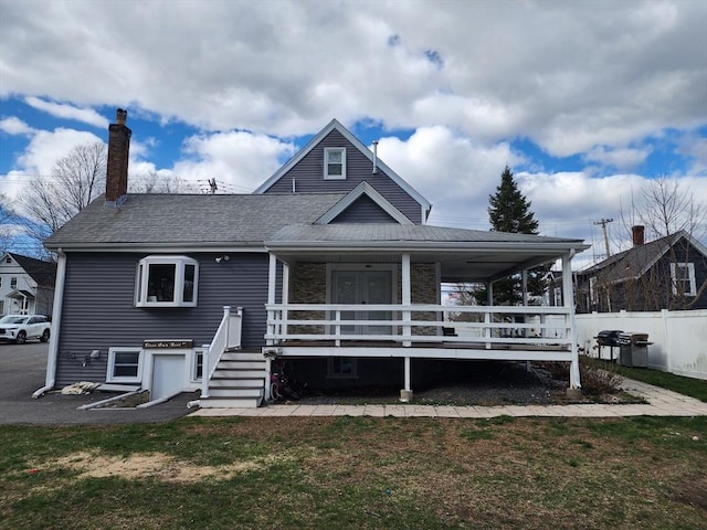 6 Pond St, Avon, MA 02322 - view of front of property with a front lawn, fence, covered porch, and a chimney