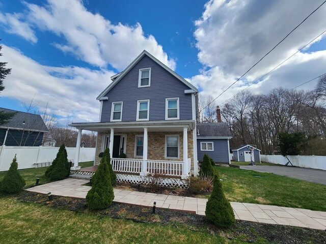 6 Pond St, Avon, MA 02322 - traditional-style house with a front yard, fence, covered porch, and an outbuilding