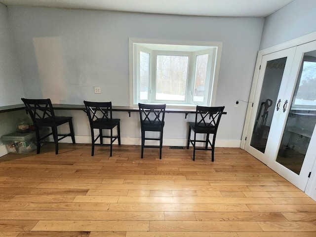 6 Pond St, Avon, MA 02322 - dining area with french doors and light wood-style flooring