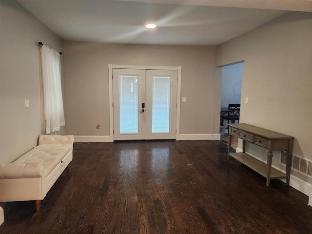 6 Pond St, Avon, MA 02322 - entrance foyer featuring french doors, wood finished floors, baseboards, and visible vents