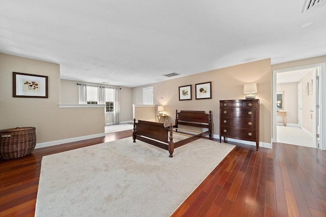 bedroom featuring dark hardwood / wood-style flooring