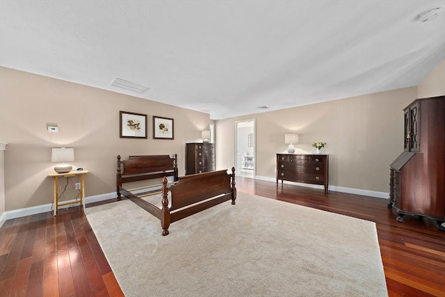 bedroom featuring dark hardwood / wood-style flooring