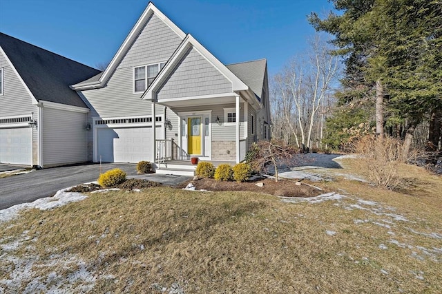 view of front facade with a garage and a front lawn