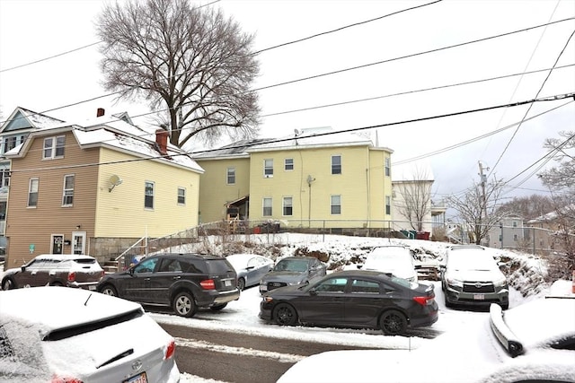 view of snow covered parking