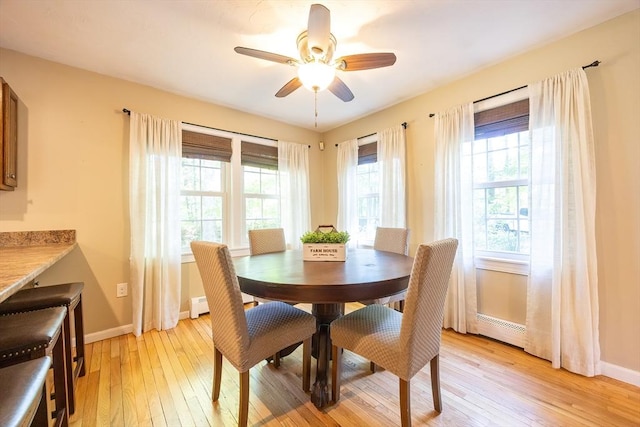 495 Creek St, Wrentham, MA 02093 - dining area featuring light wood-type flooring, a baseboard radiator, healthy amount of natural light, and baseboards