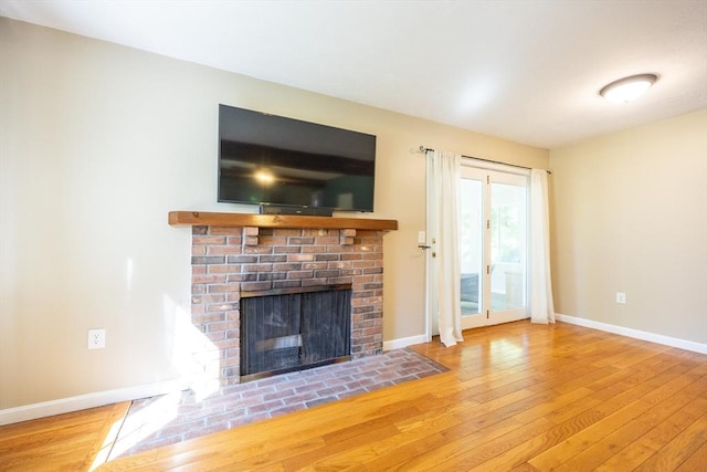 495 Creek St, Wrentham, MA 02093 - unfurnished living room featuring wood-type flooring, a fireplace, and baseboards