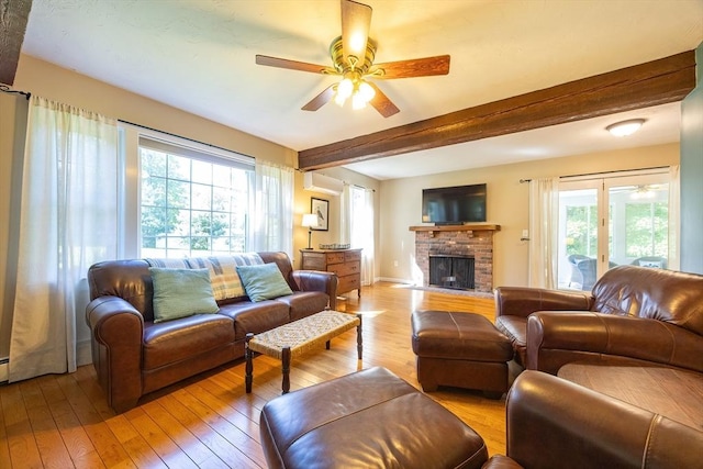 495 Creek St, Wrentham, MA 02093 - living room featuring ceiling fan, healthy amount of natural light, a wall mounted air conditioner, beamed ceiling, and light wood finished floors