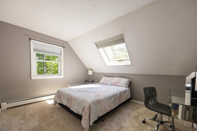 495 Creek St, Wrentham, MA 02093 - carpeted bedroom featuring a baseboard radiator, vaulted ceiling, a skylight, baseboards, and a desk