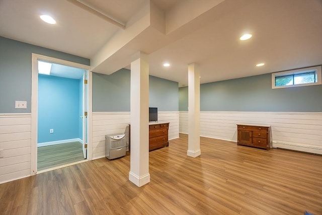 495 Creek St, Wrentham, MA 02093 - basement featuring wainscoting, a baseboard heating unit, wood finished floors, and wooden walls