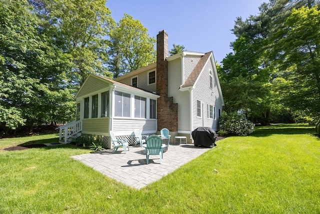 495 Creek St, Wrentham, MA 02093 - rear view of property with a sunroom, a chimney, a patio area, and a yard