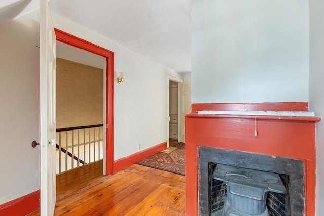 interior space with hardwood / wood-style flooring and baseboards