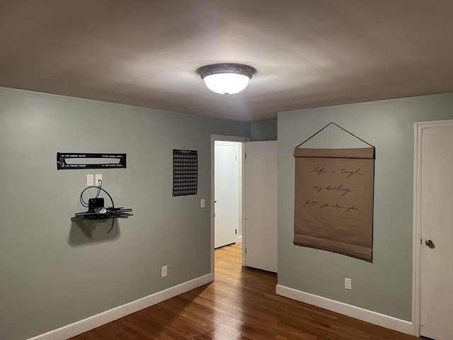 unfurnished room featuring hardwood / wood-style flooring