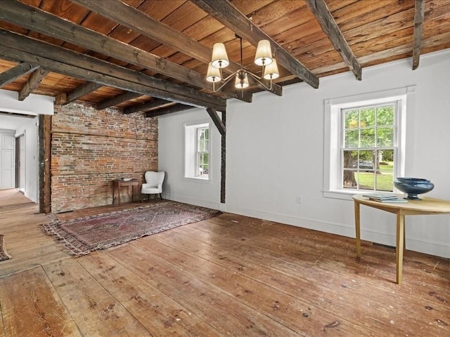 131 Cedar St, Middleboro, MA 02346 - unfurnished living room with wood-type flooring, wood ceiling with exposed beams, and a chandelier